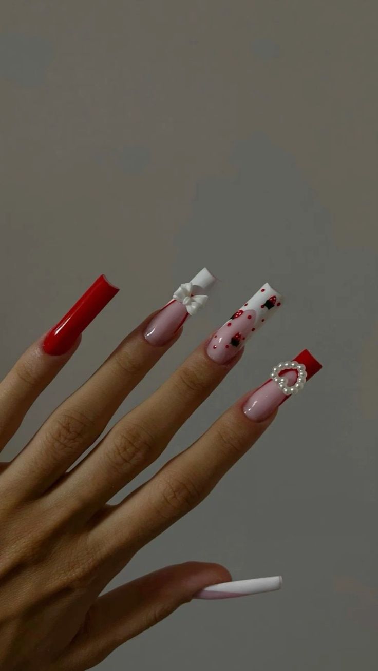 Chic Nail Design: Vibrant Red and Pink with Intricate Details