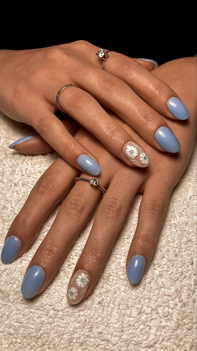 Elegant Floral-Inspired Soft Blue Nail Design for All Occasions.