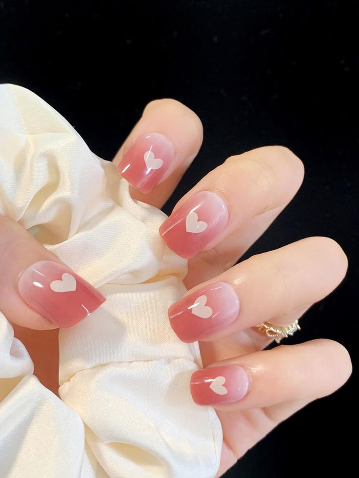 Romantic Heart-Patterned Nails with Soft Pink Gradient and Charming Accents