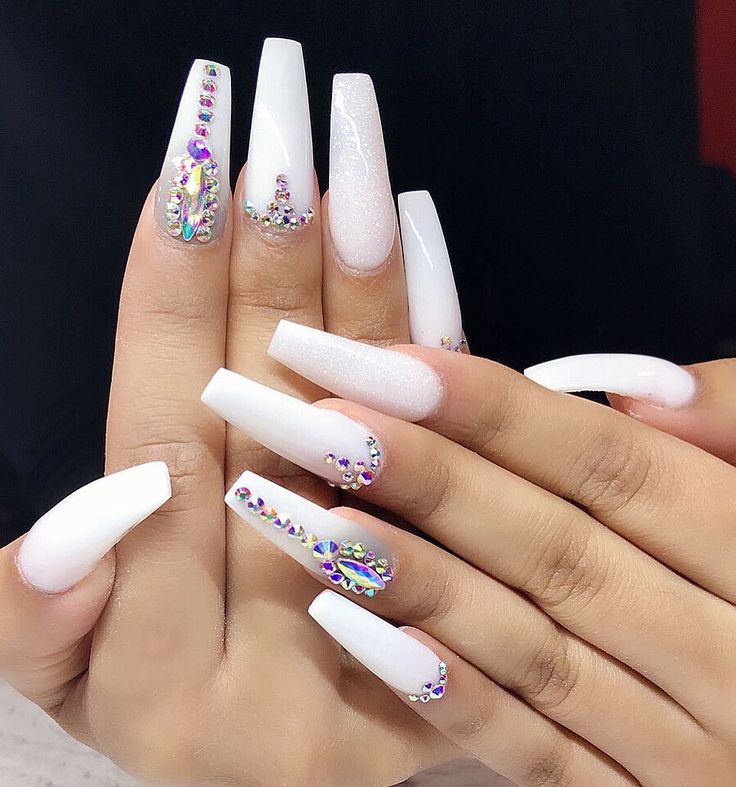 Elegant Long White Nail Design with Rhinestone Accents for Glamorous Appeal.