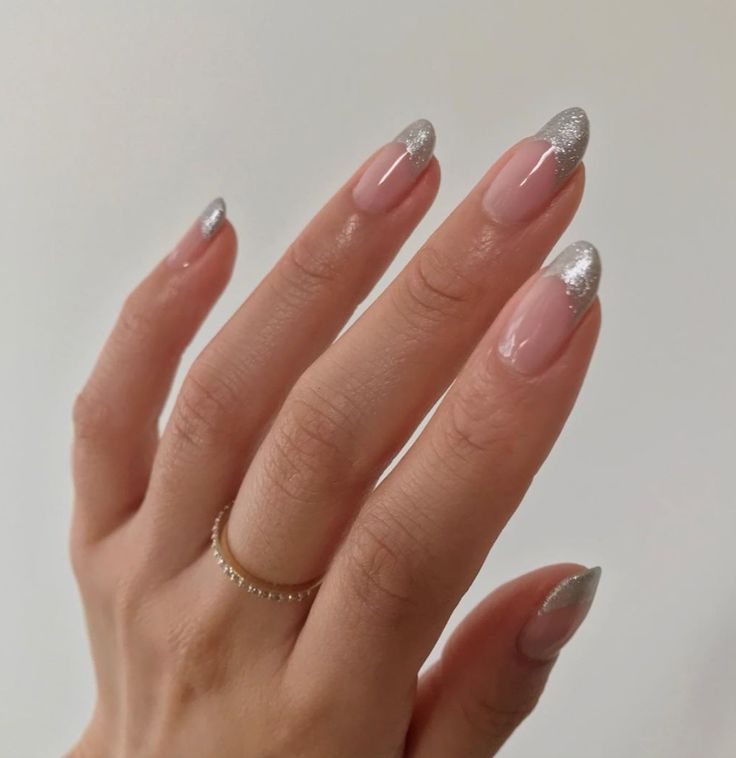 Chic Nail Design: Nude Base with Shimmering Silver Tips and Delicate Gold Accents