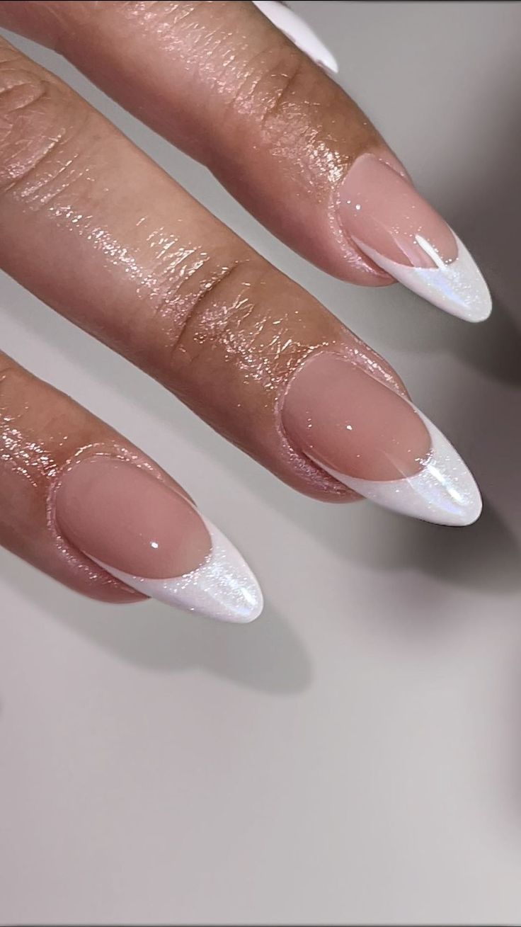 Sophisticated Almond-Shaped Nails: Glossy Nude Base with Crisp White Tips for Versatile Elegance.