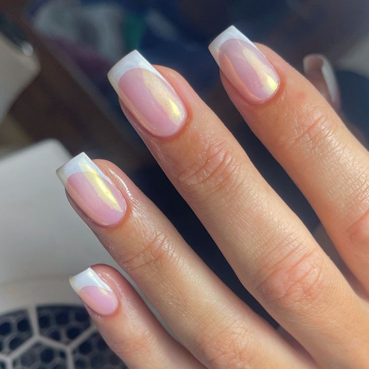 Sophisticated Soft Pink Nail Design with Glossy French Tips and Iridescent Finish