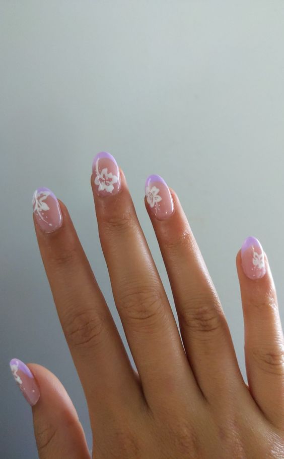 Charming Floral Nail Design with Lavender Base and Intricate White Flowers