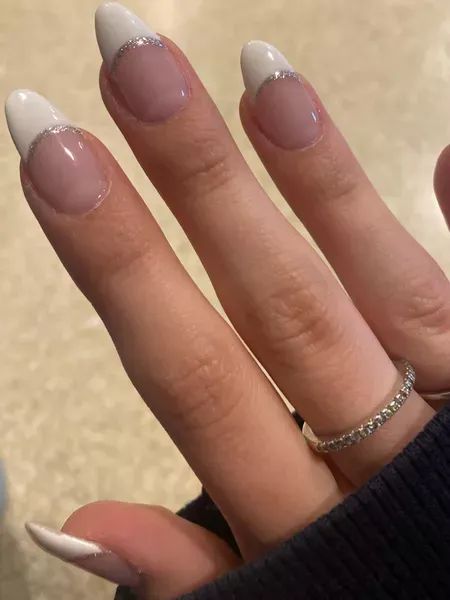 Chic Modern French Tip Manicure with Glamorous Silver Accents