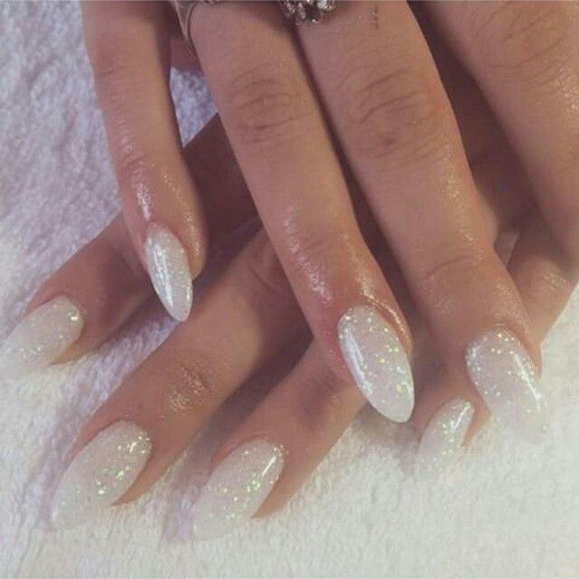 Elegant Glistening White Nail Design with Holographic Sparkles.