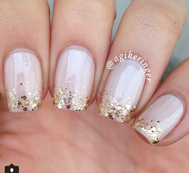 Sophisticated Nude Nails with Shimmering Gold Glitter for Glamorous Occasions.