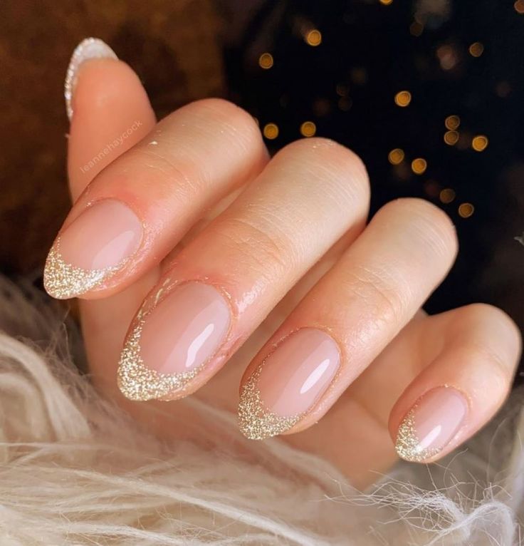 Sophisticated Nude Nails with Sparkling Gold French Tips for Elegant Occasions