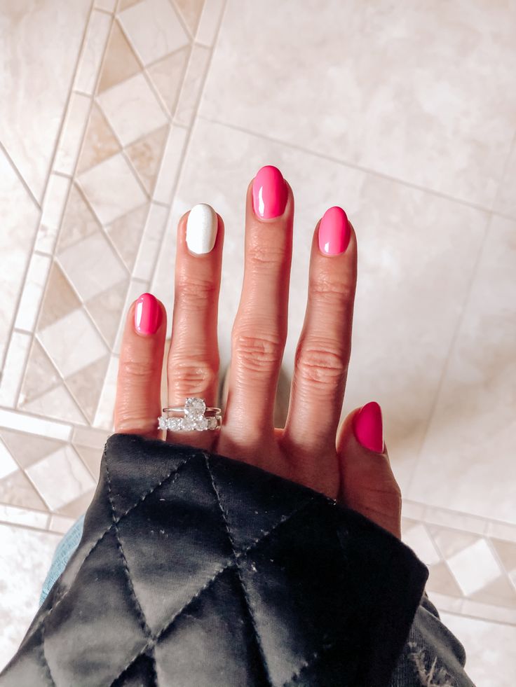 Bold Bright Pink and Crisp White Nail Design for Trendy Statement Looks.