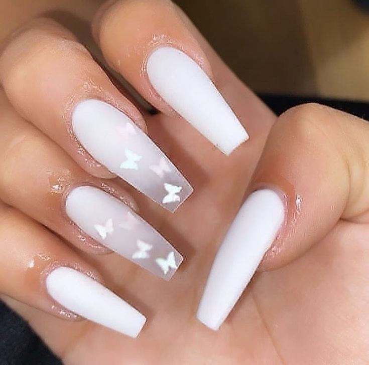 Elegant Glossy White Nail Design with Shimmering Butterfly Accents.