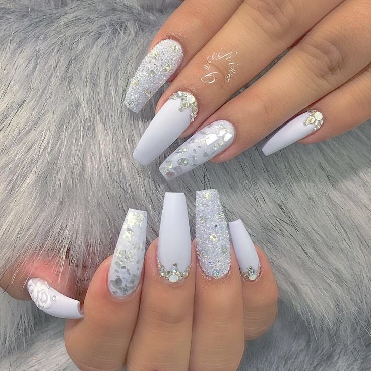 Sophisticated Stiletto Nail Design with Matte and Sparkly Pale Blue and White Finishes