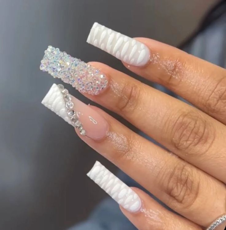 Elegant Textured Nail Design with Iridescent Centerpiece and Crystal Accents.