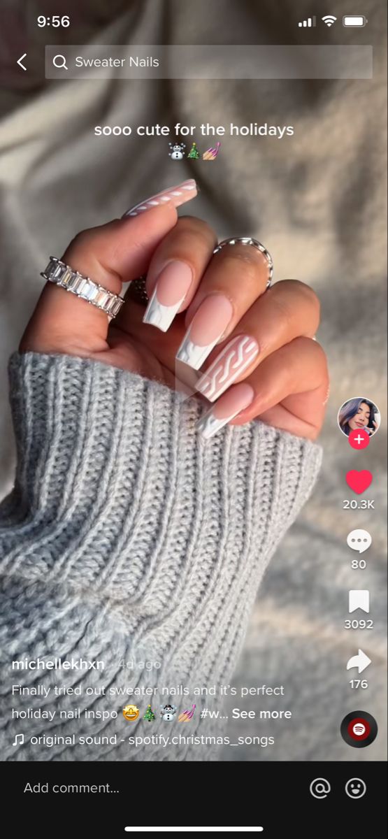 Chic Holiday Nail Design: Soft Nude Base with Cozy White Patterns