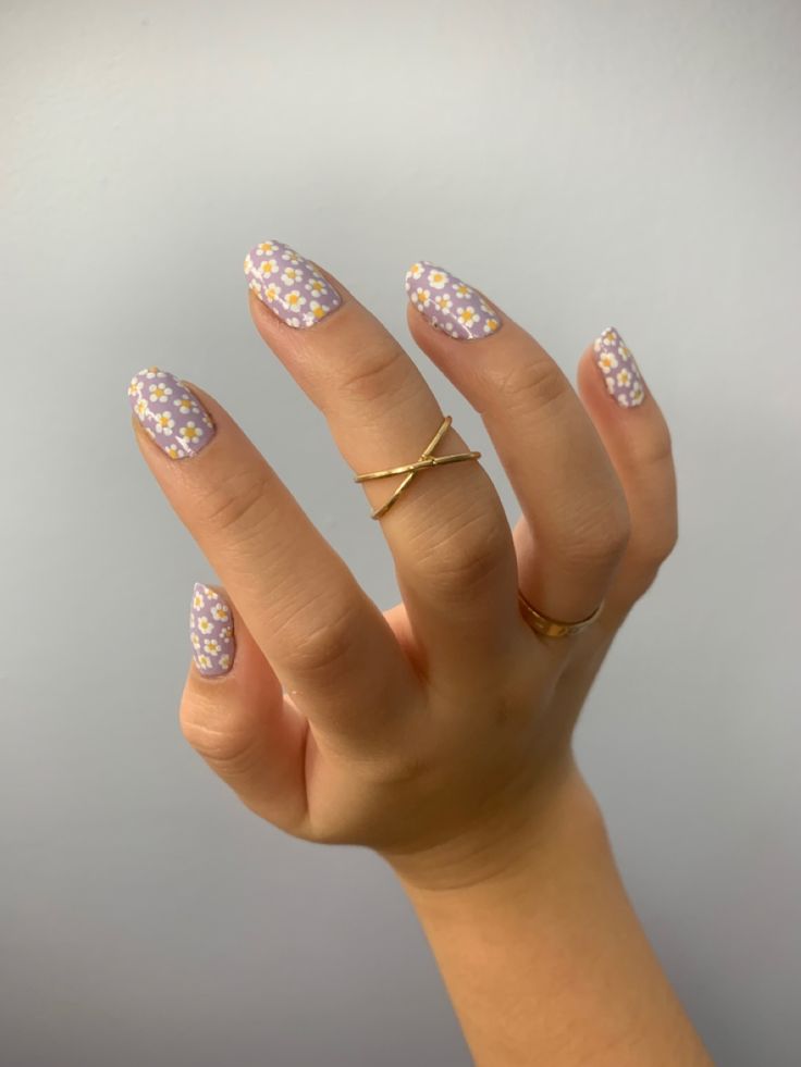 Whimsical Floral Nail Design with Lavender Base and Gold Accents