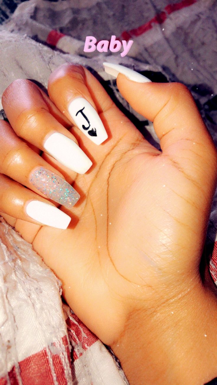 Modern Nail Design: Chic White and Glitter Accents with Hand-Drawn Symbol