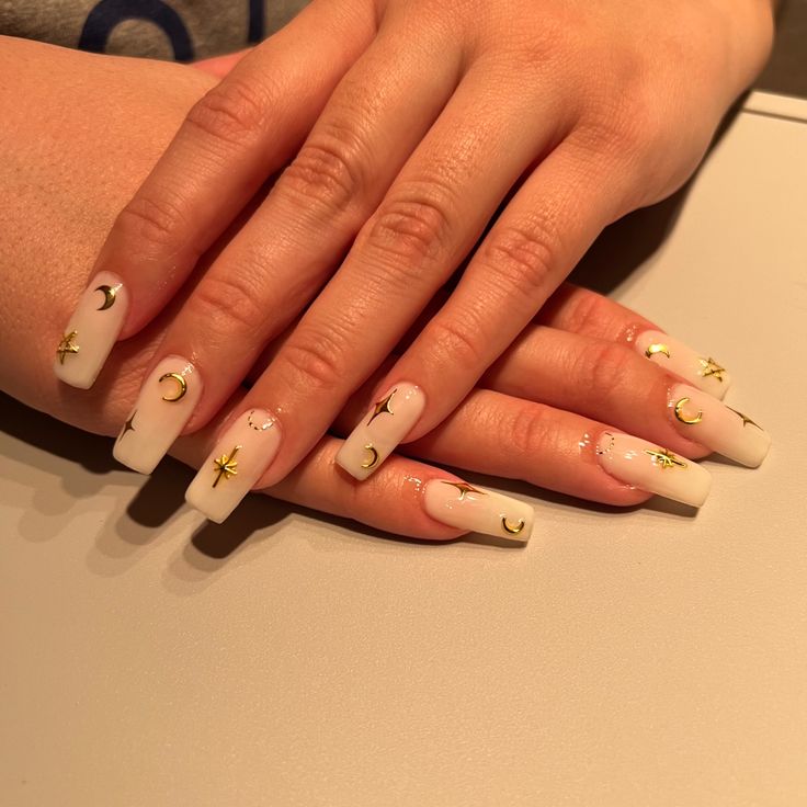 Whimsical Celestial Ombre Nail Design with Gold Accents and Moon and Star Motifs