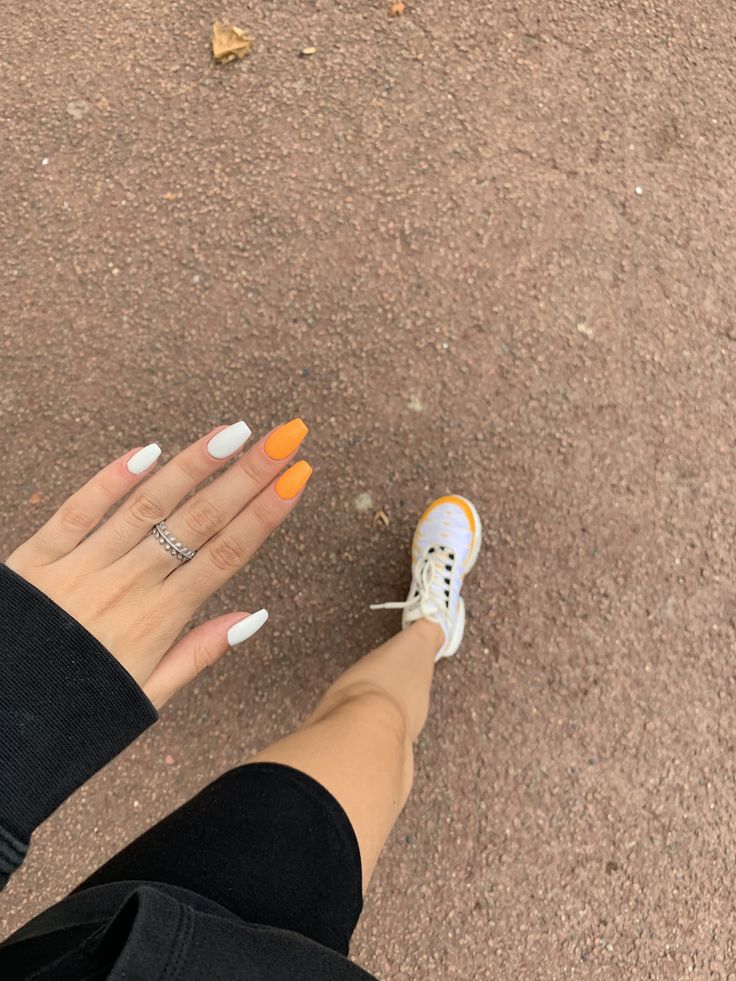 Cheerful Colorful Nail Design with Glossy White and Vibrant Orange for a Playful Look