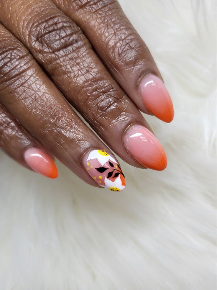 Chic Ombre Nail Design with Floral Accent for a Modern Aesthetic.