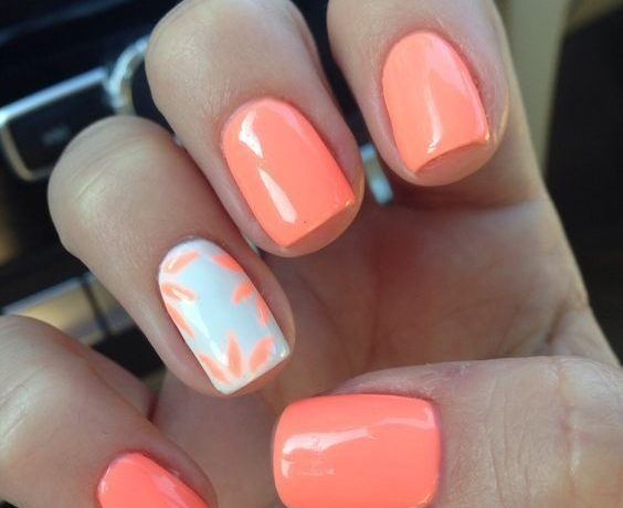 Playful Coral and Peach Nail Design with Artistic Accent Strokes for a Fresh Summer Look.