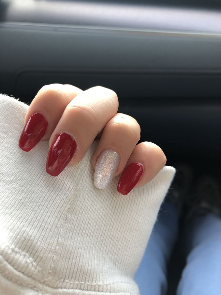 Chic Red and Silver Manicure: A Glamorous Festive Design.