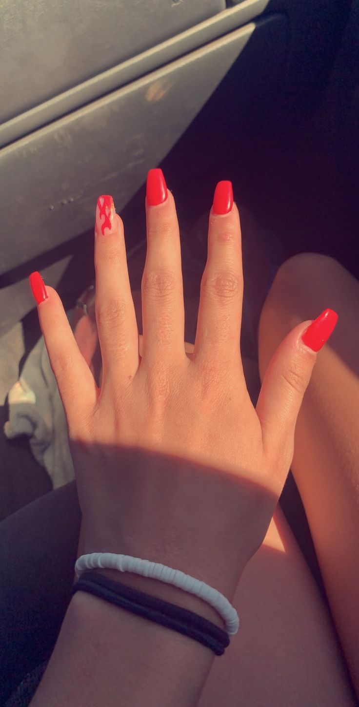 Striking Vibrant Red Nail Design Blending Classic Elegance with Edgy Drip Artistry