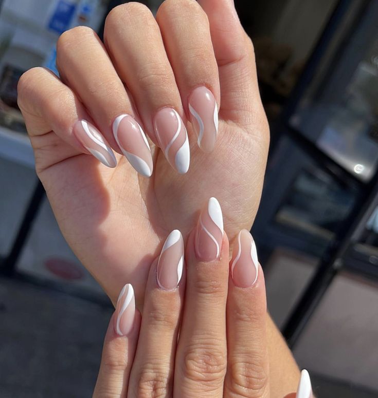 Chic Nail Design: Nude and White Waves in Pointed Elegance