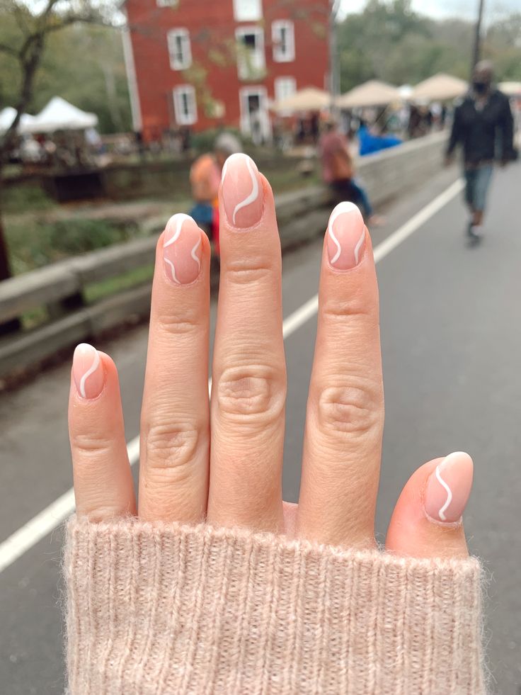 Sophisticated Elegant Nail Design: Soft Pink Base with Fluid White Waves