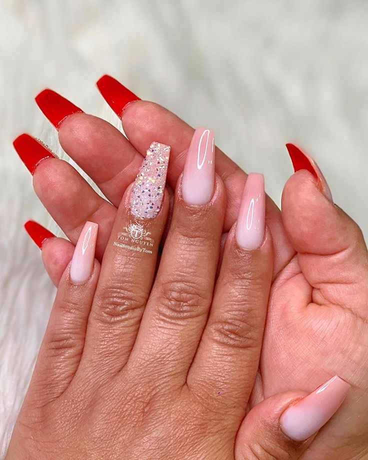 Chic Nail Design: Bold Red Tips and Sparkling Nude Elegance.