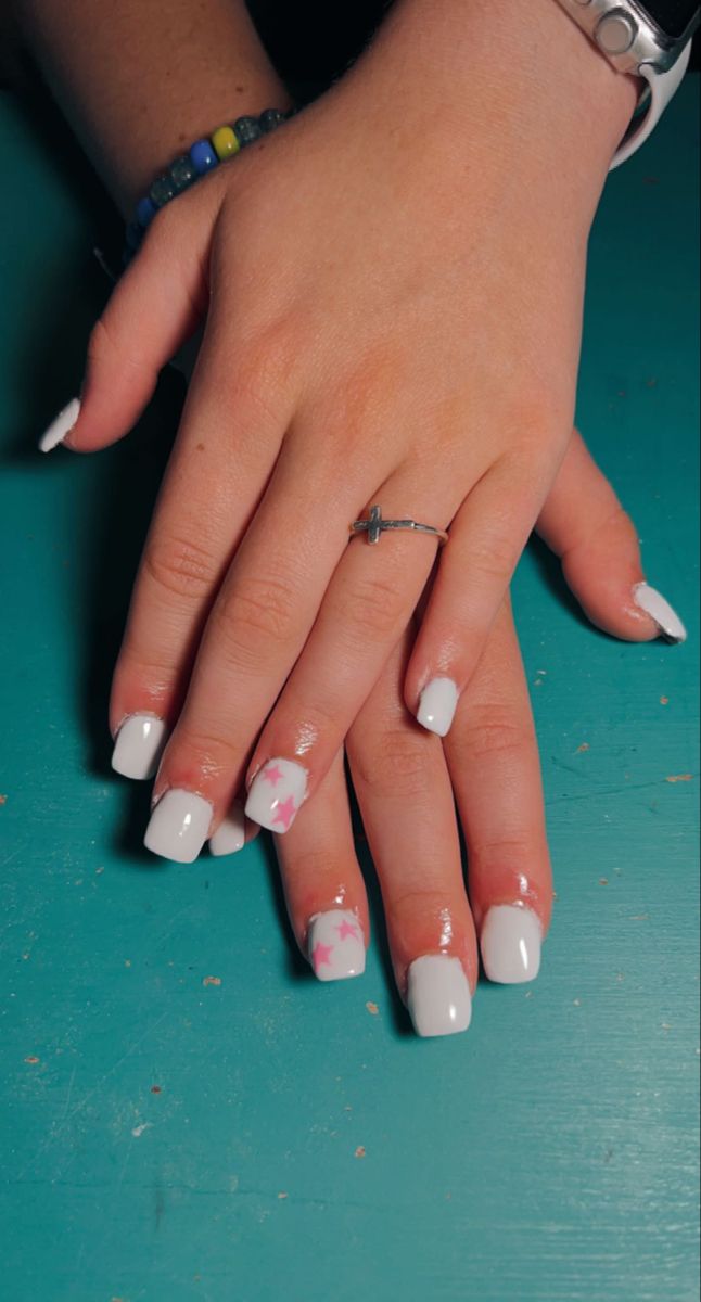 Elegant Nail Art: Classic White with Playful Pink Accents and Star Designs