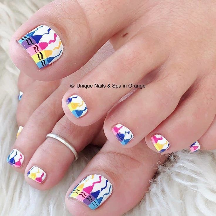 Vibrant Geometric Nail Design: A Playful Summer Statement with Bold Colors on a White Base.