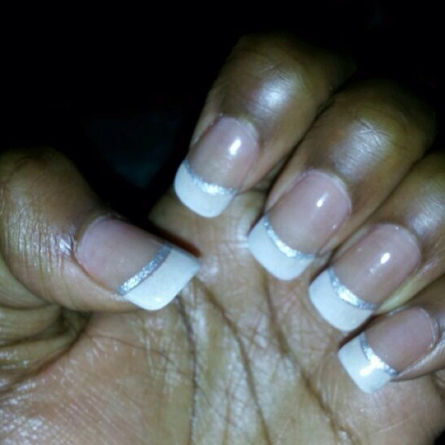 Sophisticated Elegant French Tips with Glossy White and Silver Accents.