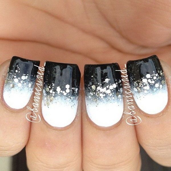 Chic Ombre Nail Design: Bold Black-to-White Gradient with Elegant Gold Glitter Accents