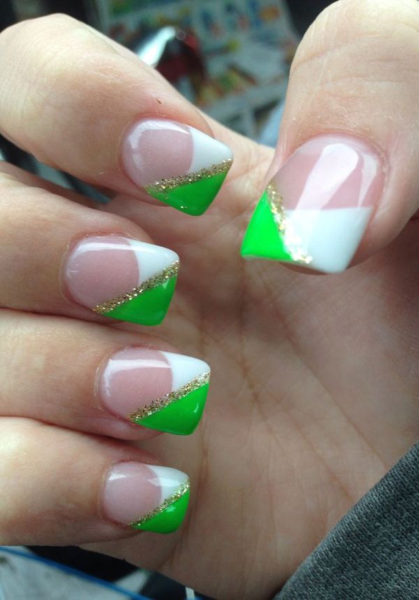 Elegant Green and White Triangular Nail Design with Gold Glitter Accents for Any Occasion.