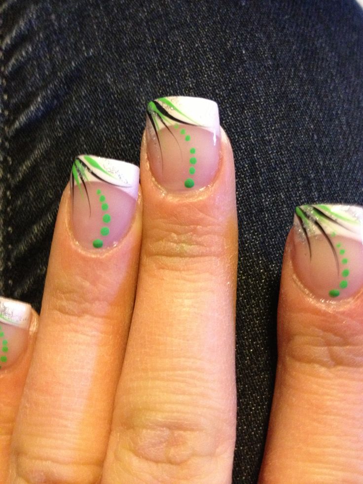 Elegant French Tip Nails with Intricate Green Accents for Any Occasion.