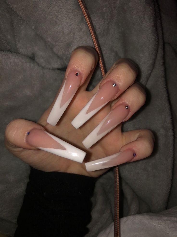 Elegant Nude and White Chevron Nail Design with Subtle Gem Embellishments