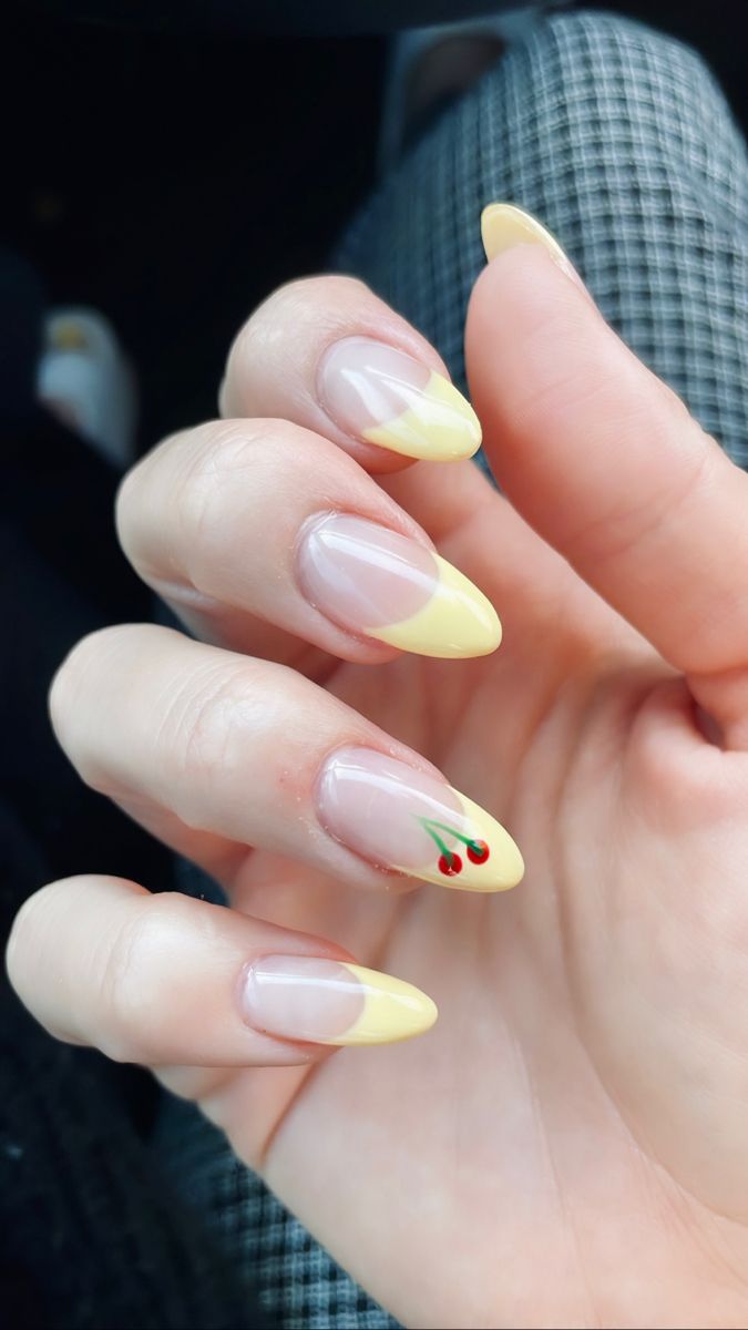 Whimsical Summer Nail Design: Soft Yellow Tips with Cherry Accents on Clear Base