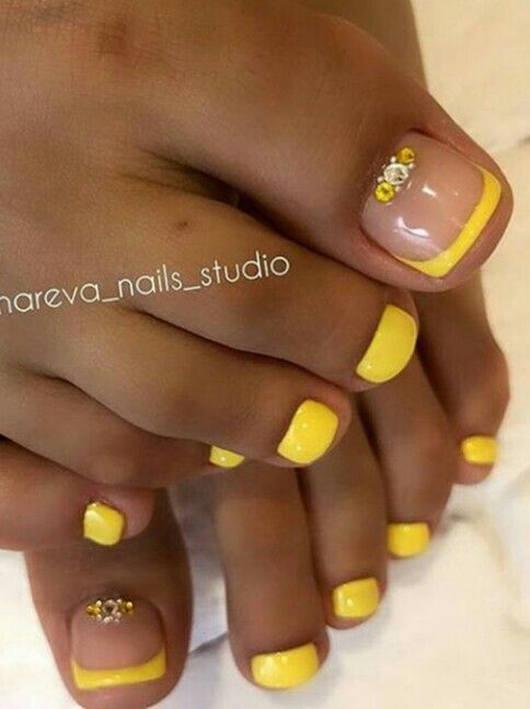 Cheerful Yellow Nail Design with Glossy Finish and Delicate Accents