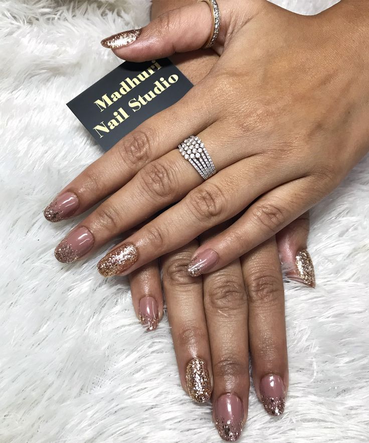 Chic Nude and Glittering Gold Gradient Nail Design for Glamorous Occasions.