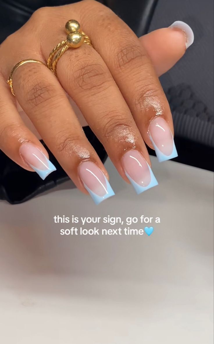 Elegant Baby Blue French Tip Nail Design with Soft Nude Base for a Modern Aesthetic.