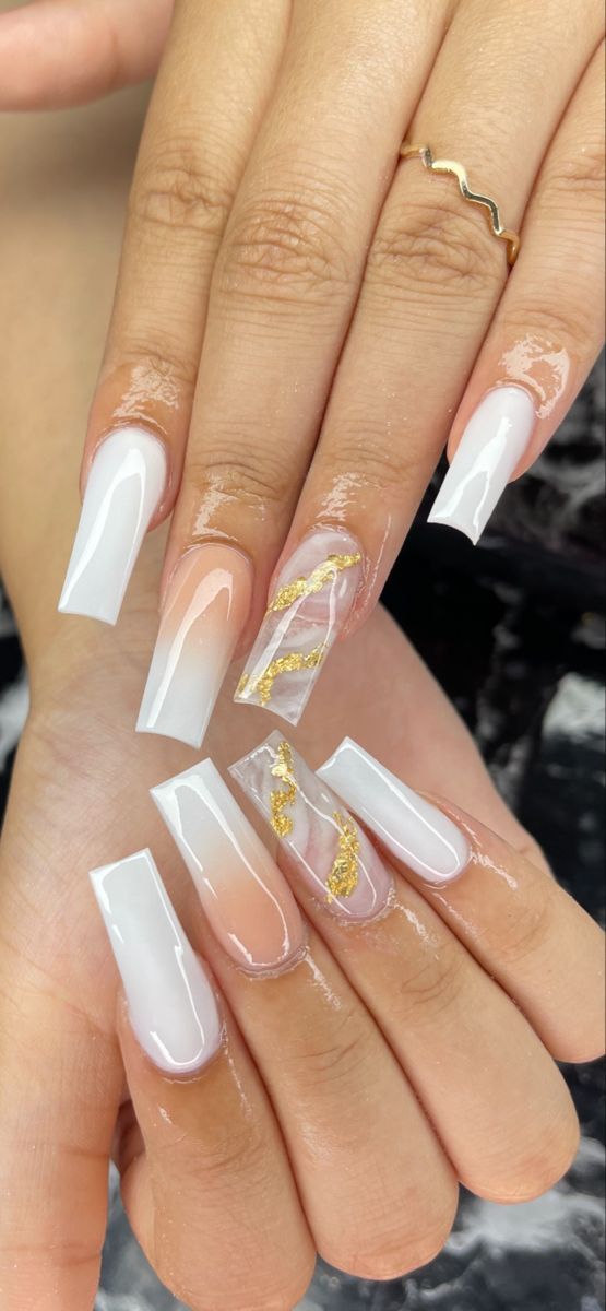 Elegantly Sophisticated Nail Design: Crisp White, Translucent Tips, and Glamorous Marble Accents.