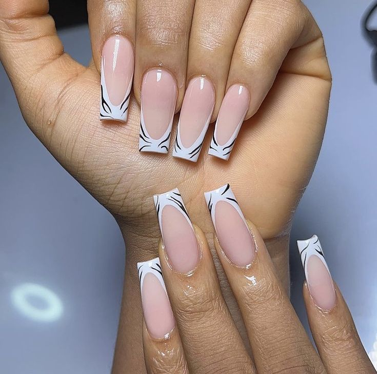 Chic Nude and White Nail Design with Intricate Black Line Art Accents