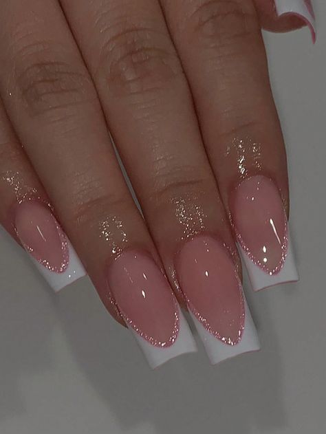 Sleek Pink and White French Tip Nails with Glamorous Glitter Accents.