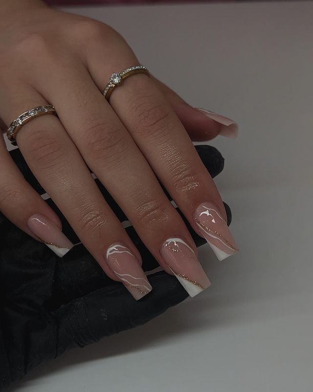 Chic Nude and White French Tip Nails with Elegant Marbling and Sparkling Accents