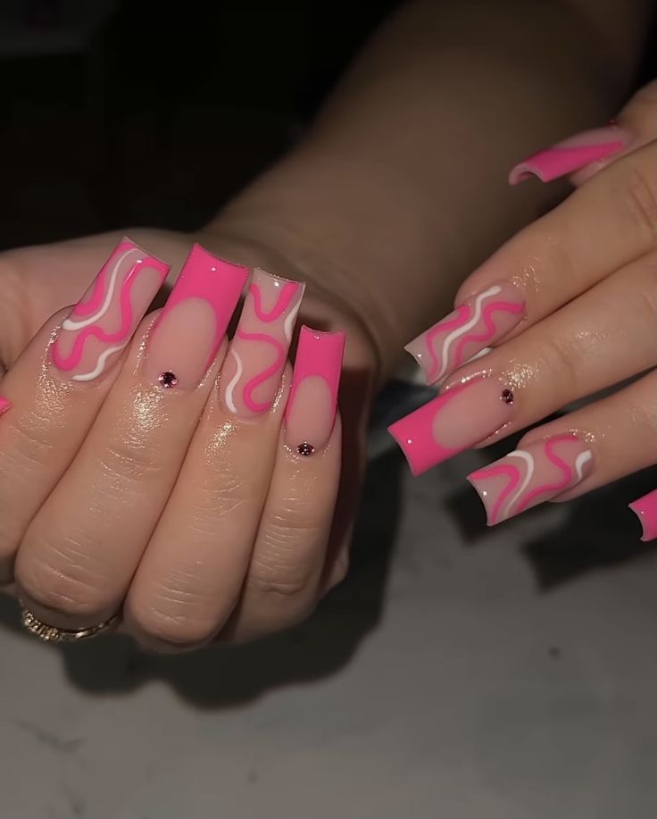 Trendy Vibrant Pink Wave Nail Art: Bold Patterns and Unique Designs for Personal Expression.