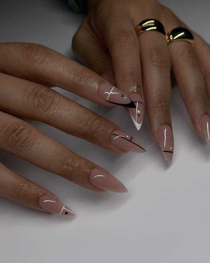 Sophisticated Almond-Shaped Nails with Nude Base and Geometric Designs