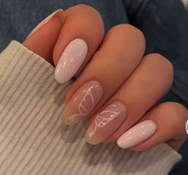 Sophisticated Soft White and Pale Pink Gradient Nail Design with Floral Elegance.