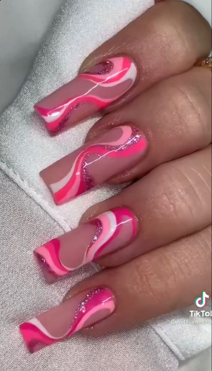 Playful Pink and White Swirl Nail Design with Glitter Accents for Bold Self-Expression.