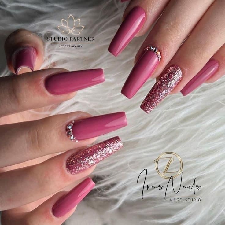 Elegant Nail Design: Matte and Glitter Finishes with Soft Pink Tones and Rhinestone Accents.