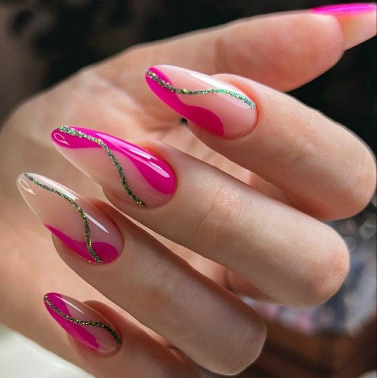 Elegant Nail Design with Glossy Pink, Clear Bases, and Shimmering Gold Accents.