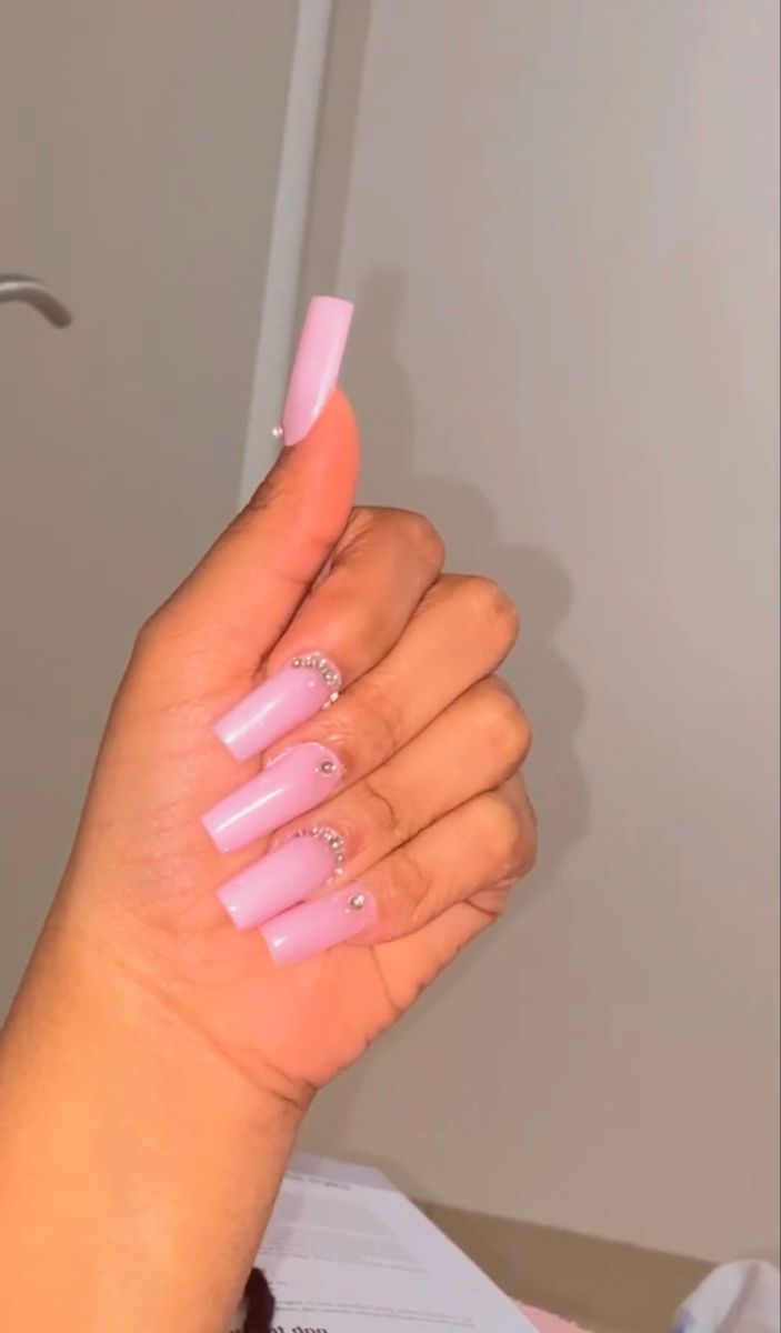 Sophisticated Nude Pink Nail Design with Sparkling Rhinestones for All Occasions